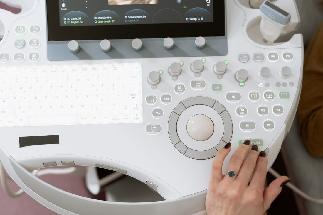 Clinician operating an ultrasound system — compatible thermal paper and Sony printer warranty explained